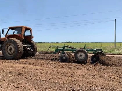 Disc harrow mixing the treated soil